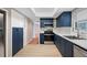Modern kitchen showcasing stainless steel appliances, subway tile, and blue cabinets at 320 Tallahassee Ne Dr, St Petersburg, FL 33702
