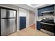 Contemporary kitchen featuring stainless steel appliances, stylish cabinetry, and new flooring at 320 Tallahassee Ne Dr, St Petersburg, FL 33702