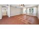 Open living room featuring a ceiling fan, patterned tile flooring, and a bright window at 320 Tallahassee Ne Dr, St Petersburg, FL 33702