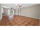 Spacious living room with patterned tile floors and French doors leading outside at 320 Tallahassee Ne Dr, St Petersburg, FL 33702