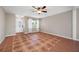 Inviting living room featuring tile floors, natural light, and a classic front door at 320 Tallahassee Ne Dr, St Petersburg, FL 33702