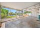 This spacious screened-in porch features a view of the canal at 320 Tallahassee Ne Dr, St Petersburg, FL 33702