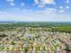 A vibrant community featuring a pond, tree-lined streets and a collection of beautiful homes at 3302 Granite Ridge Loop, Land O Lakes, FL 34638