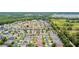 An aerial view of a residential area close to a lush conservation area at 3302 Granite Ridge Loop, Land O Lakes, FL 34638