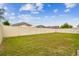 Expansive backyard enclosed with white fencing, creating a private and secure outdoor space at 3302 Granite Ridge Loop, Land O Lakes, FL 34638