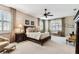 Large main bedroom with neutral walls, carpet, and decorative seating at 3302 Granite Ridge Loop, Land O Lakes, FL 34638