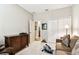 Cozy bedroom features neutral sofa, a closet and an exercise machine at 3302 Granite Ridge Loop, Land O Lakes, FL 34638