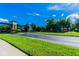 Community entrance sign amidst lush landscaping and well-maintained green spaces at 3302 Granite Ridge Loop, Land O Lakes, FL 34638