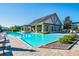 Resort-style community pool with ample seating and a well-maintained pool house at 3302 Granite Ridge Loop, Land O Lakes, FL 34638