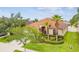 Beautiful exterior view showcasing a well-manicured front yard, palm trees, and a charming single-story home at 3302 Granite Ridge Loop, Land O Lakes, FL 34638
