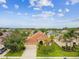 Beautiful one-story home featuring a two-car garage, manicured lawn and tropical landscaping at 3302 Granite Ridge Loop, Land O Lakes, FL 34638