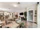 Bright living room with tile flooring, natural light, and open floor plan at 3302 Granite Ridge Loop, Land O Lakes, FL 34638
