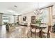 Elegant living room and dining area featuring tile floors and stylish decor at 3302 Granite Ridge Loop, Land O Lakes, FL 34638