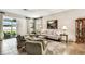 Inviting living room featuring large windows and a view of the patio at 3302 Granite Ridge Loop, Land O Lakes, FL 34638