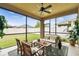 Screened patio with outdoor seating and a view of the fenced backyard at 3302 Granite Ridge Loop, Land O Lakes, FL 34638