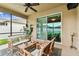 Screened lanai with ceiling fan and view of the lawn at 3302 Granite Ridge Loop, Land O Lakes, FL 34638