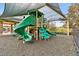 Community playground with slides, climbing equipment, and a protective shade at 3302 Granite Ridge Loop, Land O Lakes, FL 34638