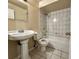 Classic bathroom with pedestal sink, tiled shower, and neutral color scheme at 3419 Pearson Rd, Valrico, FL 33596