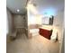Modern bathroom with a shower, bathtub, sink, and sleek cabinets at 3419 Pearson Rd, Valrico, FL 33596