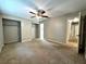 Spacious bedroom featuring a ceiling fan, closet and carpeted flooring at 3419 Pearson Rd, Valrico, FL 33596