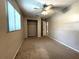 Neutral bedroom with carpet flooring, a ceiling fan, and a closet at 3419 Pearson Rd, Valrico, FL 33596