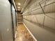 Long, narrow walk-in closet with wire shelving, providing ample storage space at 3419 Pearson Rd, Valrico, FL 33596