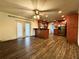 Warm kitchen with wood cabinets, a breakfast bar, and stainless steel appliances at 3419 Pearson Rd, Valrico, FL 33596