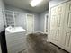 Functional laundry room featuring washer and dryer hookups and added storage at 3419 Pearson Rd, Valrico, FL 33596