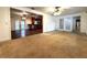 Spacious living room featuring an open floor plan leading to the dining and kitchen areas at 3419 Pearson Rd, Valrico, FL 33596