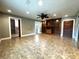 Living room boasts built-in shelving, ceiling fan and vinyl flooring at 3419 Pearson Rd, Valrico, FL 33596