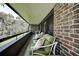 Outdoor balcony with brick accent, outdoor seating and great view at 36750 Us 19 N # 24-213, Palm Harbor, FL 34684