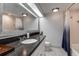 Bathroom features a spacious countertop, clean white tile, and great lighting at 36750 Us 19 N # 24-213, Palm Harbor, FL 34684