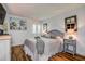Bright bedroom with neutral tones, a comfortable bed, and stylish decor, with wood-look flooring at 36750 Us 19 N # 24-213, Palm Harbor, FL 34684