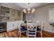 Charming dining room with modern lighting and decor with built-in shelving at 36750 Us 19 N # 24-213, Palm Harbor, FL 34684