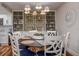 Elegant dining room with a stylish chandelier, seating for six, and lovely built-in shelving at 36750 Us 19 N # 24-213, Palm Harbor, FL 34684