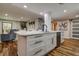 Kitchen island with stainless appliances and open to the living room at 36750 Us 19 N # 24-213, Palm Harbor, FL 34684