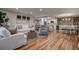 Spacious open-plan living and dining area with wood floors and lots of bright, natural lighting at 36750 Us 19 N # 24-213, Palm Harbor, FL 34684