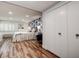 Bedroom featuring lots of closet space, wood floors, and accent wall at 36750 Us 19 N # 24-213, Palm Harbor, FL 34684