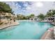 Inviting outdoor swimming pool with waterfall feature and lounge chairs at 36750 Us 19 N # 24-213, Palm Harbor, FL 34684