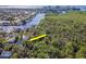 Beautiful aerial view of home nestled amongst trees with waterfront access and city views at 4202 Deepwater Ln, Tampa, FL 33615