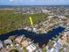 Waterfront home featuring a private boat dock and pool, perfect for enjoying the coastal lifestyle at 4202 Deepwater Ln, Tampa, FL 33615