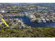 Waterfront living at its finest with lush greenery and access to boat docks for endless aquatic adventures at 4202 Deepwater Ln, Tampa, FL 33615