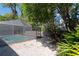 Backyard gravel space next to screened in pool at 4202 Deepwater Ln, Tampa, FL 33615