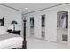 Bedroom view featuring large closet with folding doors and built-in organizers for optimal storage at 4202 Deepwater Ln, Tampa, FL 33615