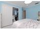 Bright bedroom showcases a large closet with folding doors and ample storage options at 4202 Deepwater Ln, Tampa, FL 33615