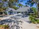 Charming home featuring an extensive driveway and lush landscaping at 4202 Deepwater Ln, Tampa, FL 33615
