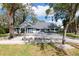 Charming two-story home with mature trees, a long driveway and lovely landscaping at 4202 Deepwater Ln, Tampa, FL 33615