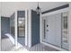 Inviting front porch with painted siding, new lighting, and paneled trim at 4202 Deepwater Ln, Tampa, FL 33615