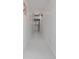Bright hallway featuring white marble floors and artwork leading into the kitchen at 4202 Deepwater Ln, Tampa, FL 33615
