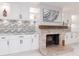 Elegant living room featuring a brick fireplace, custom cabinetry, and stylish decorations creating an inviting atmosphere at 4202 Deepwater Ln, Tampa, FL 33615